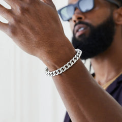 4mm silver cuban chain bracelet worn on wrist by male model